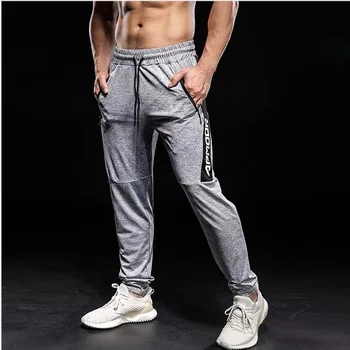 Mężczyźni biegowe spodnie siłownia spodnie odzież sportowa spodnie Męskie biegowe przekleństwa jogging, sportowe spodnie damskie z kieszeniami na zamek